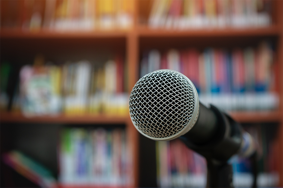 Microphone set up on a stand in a library